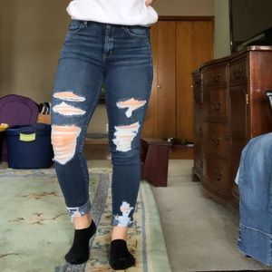 Dark blue ripped jeans